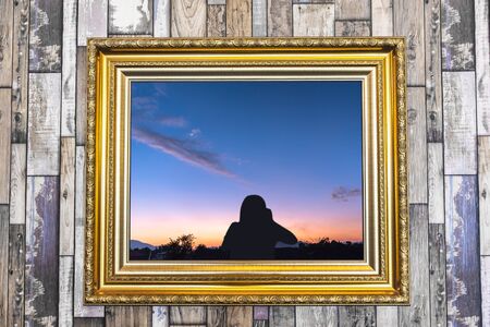 vintage picture frame on wooden wallの写真素材