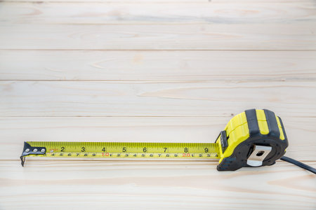 tape measure on the wooden background