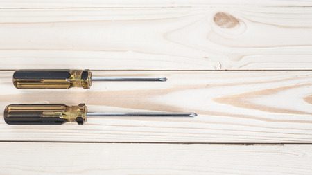 Screwdrivers on wooden backgroundの写真素材