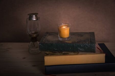 Set with ancient books with candle lights and lantern, Set with ancient books with candle lights and lanternの写真素材