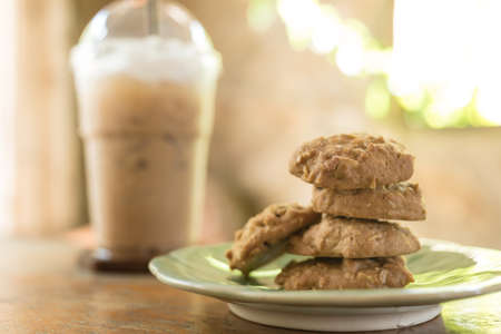 Chocolate chip cookies, A plate of freshly baked chocolate chip cookies with coffee backgroundの写真素材