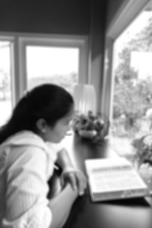 blurred image of a woman reading the holy bible in the church for religion backgroundの写真素材