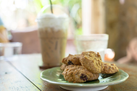 Chocolate chip cookies, A plate of freshly baked chocolate chip cookies with coffee background
