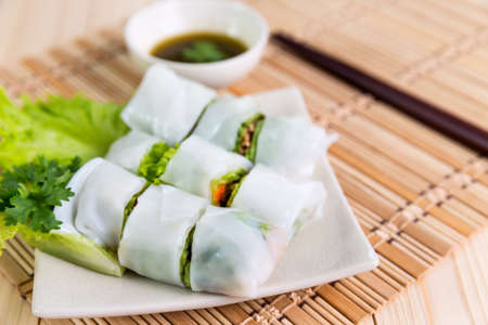 Portion of spring rolls with vegetables, vegetables in noodle tubeの写真素材
