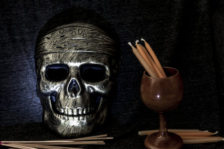 still life concept human skull mask on dark background, Halloween backgroundの写真素材