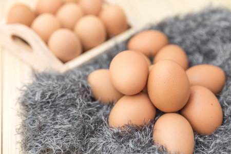 Close up eggs on wool background, raw eggs, selective focus