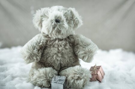christmas teddy bear sitting in the snow : vintage styleの写真素材