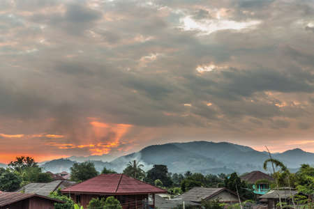 House roofs at sunset, landscape with views of house at sunsetの写真素材