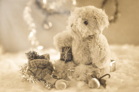 christmas teddy bear sitting in the snow : vintage styleの写真素材
