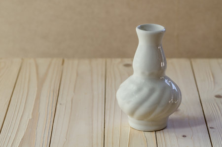 empty white vase,stock image of the vase on wood backgroundの写真素材