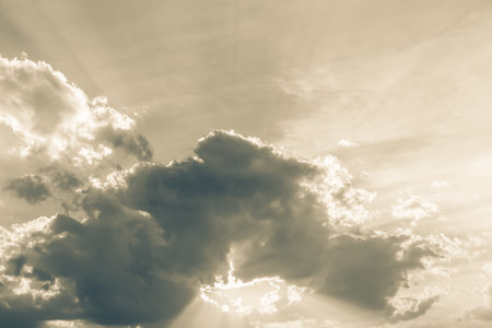 Sunbeam through the haze on sky: can be used as background and dramatic look, Ray of lights through the cloudsの写真素材