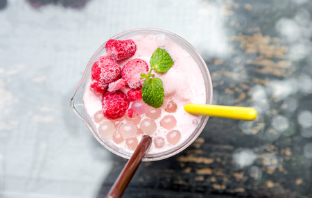 strawberry healthy milkshake drink,strawberry fruit smoothies with strawberry pieces in glass with...