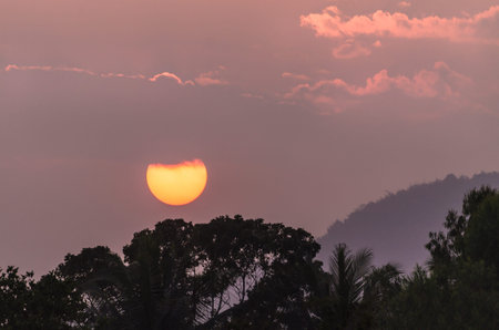 High contrast Sunset with mountains and tree, Hills and orange sky during sunrise