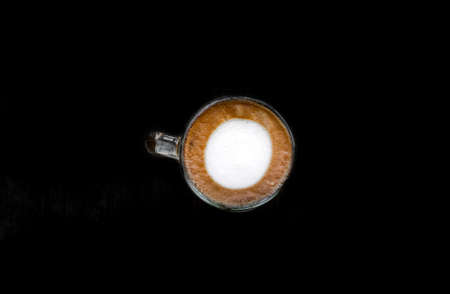 mug of coffee from above on black background, cup of coffeeの写真素材