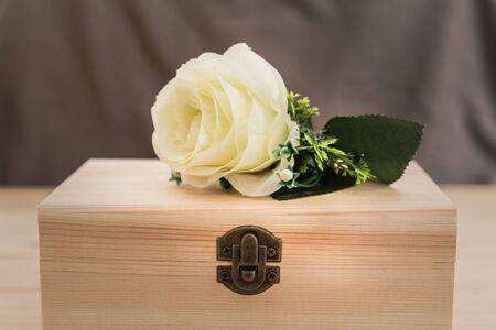 still life with rose on wooden box - Selective focusの写真素材