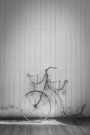 beautiful decorative vintage bicycle model near the brick wallの写真素材