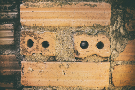 old brick wall outside the building, may use to interior design - vintage toneの写真素材