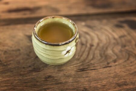 Cup of tea on wooden table - vintage styleの写真素材