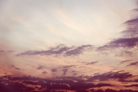 Nature composition : colorful dramatic sky with cloud at sunset - vintage toneの写真素材