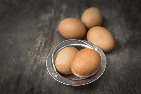 raw eggs in a bowl on the old wooden table : vintage colorの写真素材