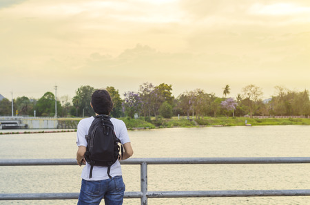 Asian woman standing look view of the lakeの写真素材
