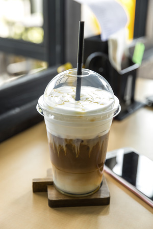 iced caramel macchiato in plastic glassの写真素材