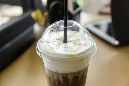 iced caramel macchiato in plastic cupの写真素材