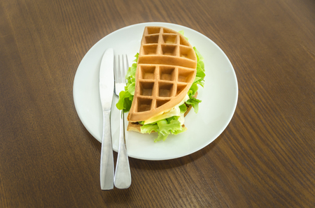 vegetarian food concept : waffle sandwich with cheese served for morning timeの写真素材