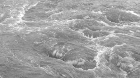 splashing waves shot from directly above - black and whiteの写真素材