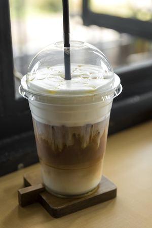 iced caramel macchiato in plastic cupの写真素材