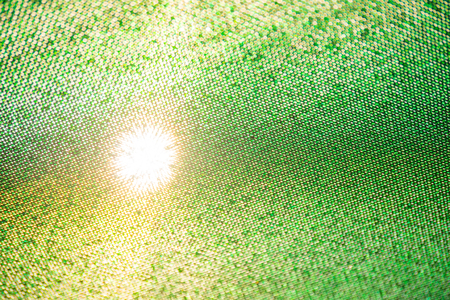 Green net texture with sun shining throughの写真素材