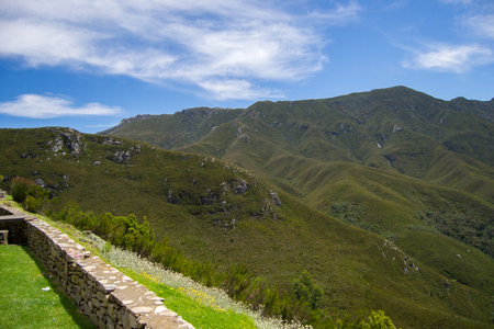 Mountains landscape with green vegetation, blue sky with clouds and stone hengeの写真素材