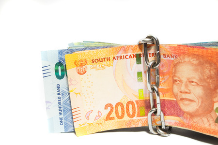 Keep your money safe concept with chain over zar banknotes on whiteの写真素材
