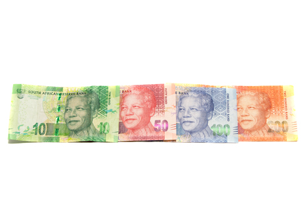 Rand banknotes from South-Africa placed in a straight line on white backgroundの写真素材