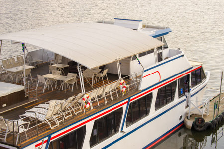 Luxury boat top view for cruises on the river with chairs, tables and hot tub on the upper deck