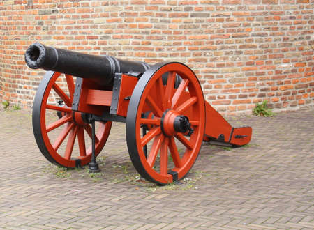 Medieval cannon on the wall of the city gate "Sassenpoort" in Zwolle. the Netherlandsの写真素材