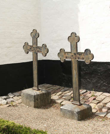 Nykøbing. June-15-2017. Two fatal crosses at the Karleby Church in Nycobing on the island Falster. Denmarkのeditorial素材