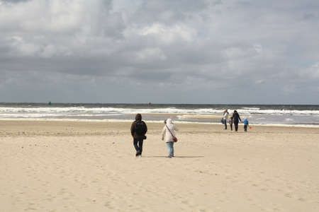 Tourist walking on the beach of the island Vlieland. the Netherlandsの写真素材