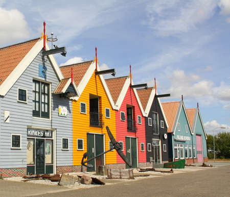 Salt camp. August 05-2018 Colored warehouses in the harbor of Zoutkamp. the Netherlandsのeditorial素材