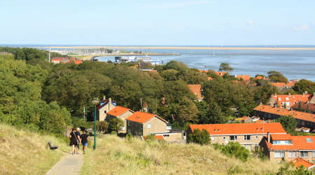 Vlieland. August-13-2017. Tourists walk on the island of Vlieland. The Netherlandのeditorial素材