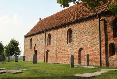 Ezinge. August-16-2020. The Church of Ezinge and gravestones from the 13th century in the village Ezinge. the Netherlandsのeditorial素材