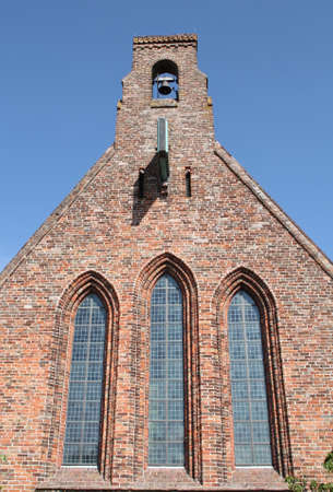 Abbey Church with bell from the 12th century in the village aduard. the Netherlandsの写真素材