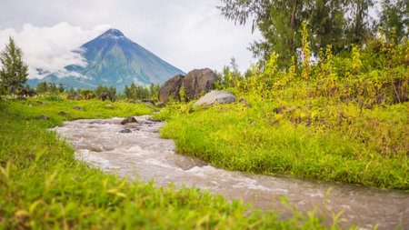 River near Mayon Volcano is an active stratovolcano in the province of Albay in Bicol Region, on the...