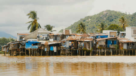 Slums in Nha Trang. Houses on the river. Vietnam.の写真素材
