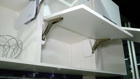 Kitchen white furniture. Pull-out cabinets white color.の写真素材