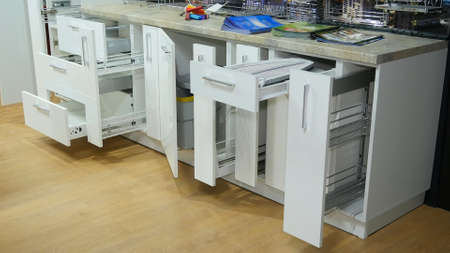 Kitchen white furniture. Pull-out cabinets white color.の写真素材