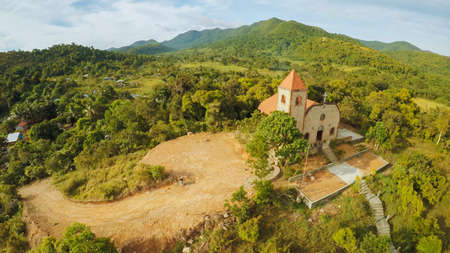 Church on a hill in Malbato village. Philippines. Coron. Palawan. Aerial view.の写真素材