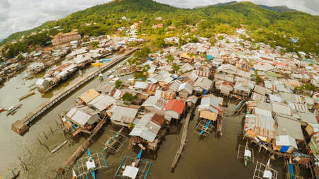 Philippine slums on the beach. Poor area of the city. Coron. Palawan. Philippines.の写真素材