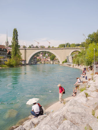 Bern, Switzerland - August 6, 2018: Cityscape view on the old town with river and bridge in Bern...