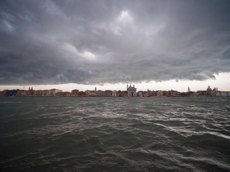 Panorama of Venice in black thunder clouds.の写真素材